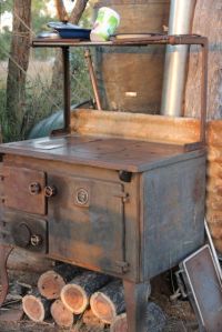 The old stove for cooking, night time warmth and the water heater. photo by Jill Sampson